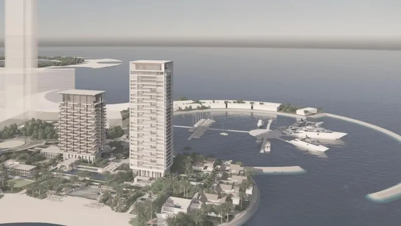 Rendered view of the JANU Marjan development: the hotel and residential towers above the marina, with villas along the shoreline.